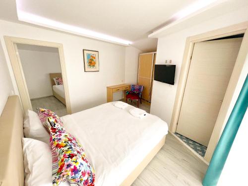 Postel nebo postele na pokoji v ubytování Mercan Otel