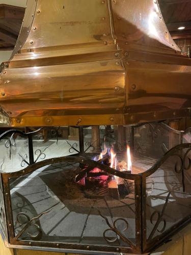 a piano with a fire inside of it at Saaserhof Apartments in Saas-Fee
