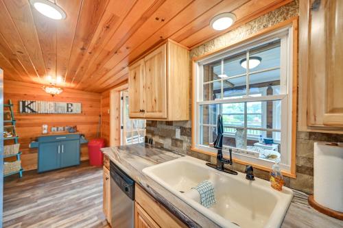 a kitchen with a sink and a window at Our Lakeside Retreat with Deck on Lake Herrington! in Bushtown