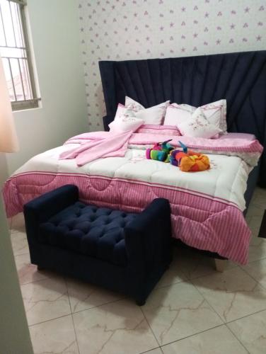 Ένα ή περισσότερα κρεβάτια σε δωμάτιο στο Benitah One Bedroom Home 2