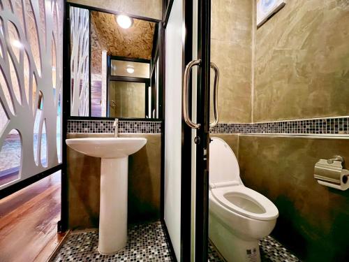 Koupelna v ubytování ธารามนตรา รีสอร์ท (Taramontra resort)