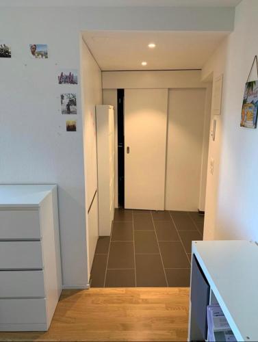 a kitchen with a hallway with a door to a room at Wohnung in Zürich Kreis 3 befristet in Zurich