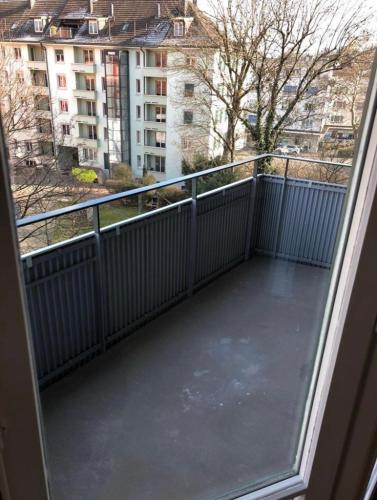 an empty balcony with a view of a city at Wohnung in Zürich Kreis 3 befristet in Zurich