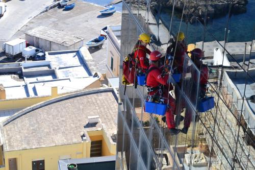a group of people standing on the side of a ship at Hotel Bellavista Club-Caroli Hotels in Gallipoli