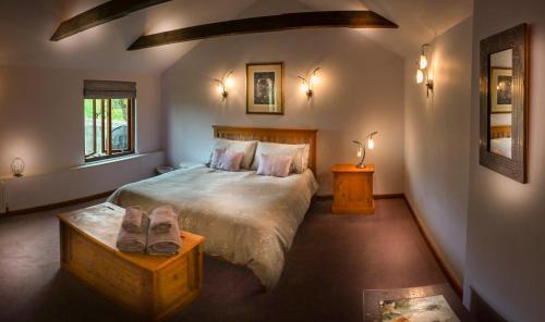 a bedroom with a bed and a pair of shoes at The Tool Shed in Wimborne Minster