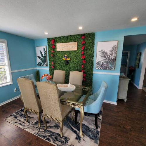 a dining room with a table and chairs at 18Th Street - Galveston Seawall Close to Attractions! Remodeled! in Galveston