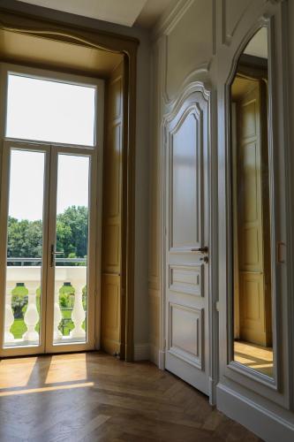 an empty room with a door and a window at Séquoias Golf & Ressort in Ruy
