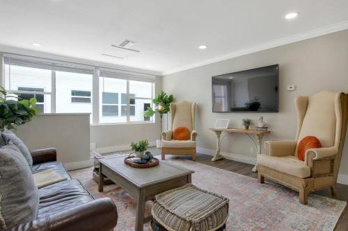 a living room with a couch and chairs and a table at New 2BR Bungalow Apartment #5 in West Palm Beach