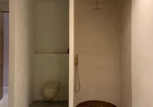 a bathroom with a toilet and a shower stall at Numa Experimental in Pontevedra