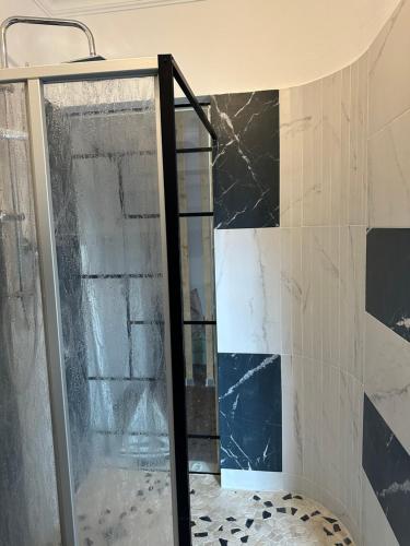 a shower with a glass door in a bathroom at Damien in Bad Bergzabern