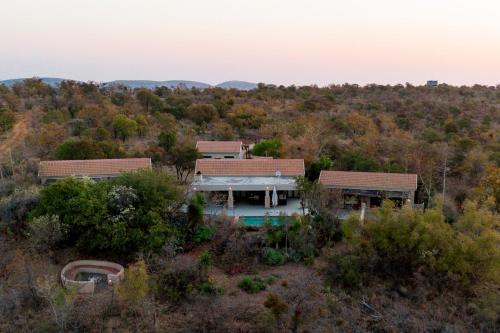 an aerial view of a house in the woods at Elements Bush Villa 295 in Mabula