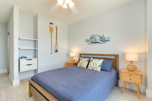 a bedroom with a blue bed and two night stands at Oceanfront Galveston Condo in Amazing Location! in Galveston