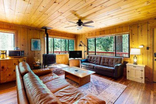 a living room with a couch and a table at Cozy Seclusion in South Lake Tahoe