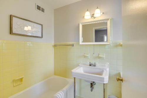 a bathroom with a sink and a bath tub at Rapid City Home Near Parks and Hiking! in Rapid City