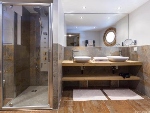 a bathroom with two sinks and a shower at Chalet Avoriaz, 5 pièces, 10 personnes - FR-1-314-113 in Avoriaz