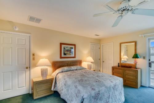 a bedroom with a bed and a ceiling fan at The Myllet at Ships Watch in Duck