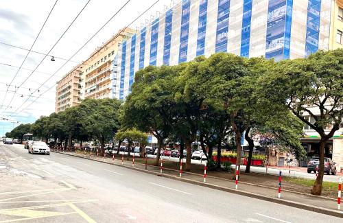 a street with trees on the side of a road at Maison d'Or in Genova
