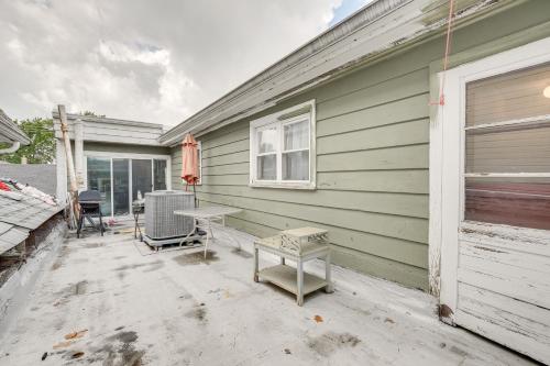 a patio with a table and chairs next to a house at Berwyn Apartment Rental about 11 Mi to Chicago! in Berwyn