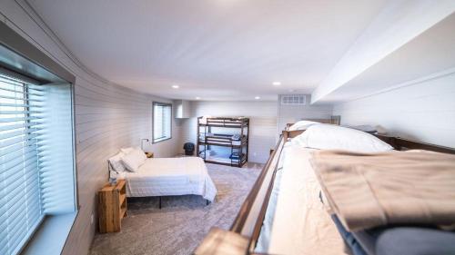 a bedroom with two beds and a bunk bed at Teton Family Retreat- West Dome in Ashton