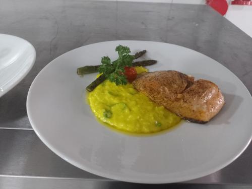 a plate of food with a piece of bread and eggs at Hotel Global Grupos in Sao Paulo