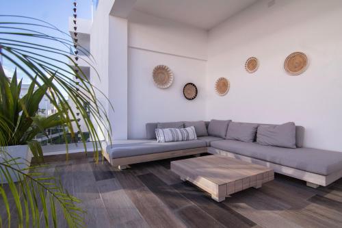 a living room with a couch and a coffee table at New Beachfront Penthouse Punta Popy in Las Terrenas