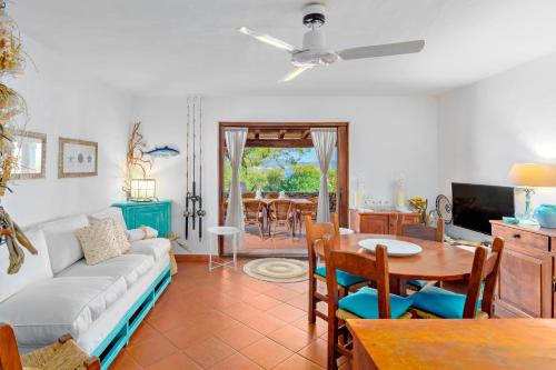 a living room with a couch and a table at La casa di Fra' in Porto Rotondo