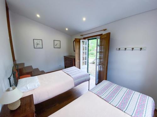 Postel nebo postele na pokoji v ubytování Casa do Crasto
