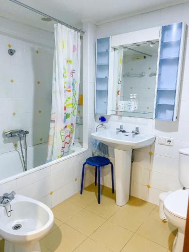 a bathroom with a sink and a toilet and a mirror at Casa do Crasto in Amarante
