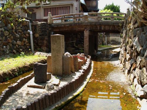 a bridge over a canal with a waterway at Guesthouse Nara Komachi in Nara