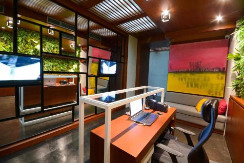 a office with a desk with a laptop on it at Boutique Rooms in Belgrade