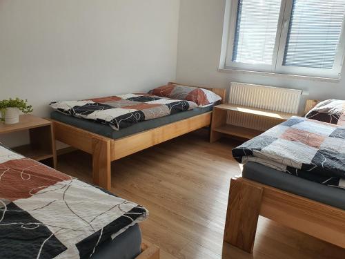 Ένα ή περισσότερα κρεβάτια σε δωμάτιο στο Apartmán Ostrov nad Oslavou