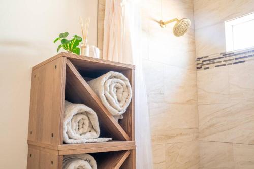 a wooden towel rack in a bathroom with towels at Rustic Gold Retreat in Kanab