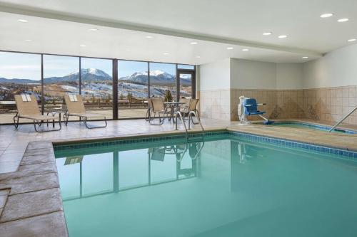 a swimming pool with a view of the mountains at Hampton Inn & Suites Silverthorne in Silverthorne