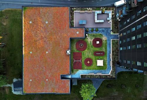 an overhead view of a house with a garden and a building at Penthouse apartment with an amazing view in Tallinn