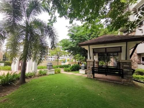 a park with a gazebo and a green yard at Alles One Oasis Condo Davao Near SM Mall with Wifi in Davao City