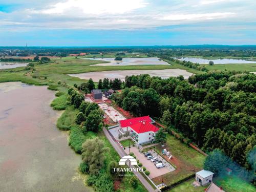an aerial view of a farm with a red roof at Tramonto Apartments Zator Przeciszów in Zator