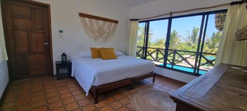 Postel nebo postele na pokoji v ubytování Hotel Taboga Eco Boutique & Spa Costa Esmeralda