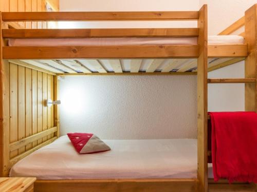 a bedroom with a bunk bed with white sheets at Studio Les Arcs 1800, 1 pièce, 4 personnes - FR-1-346-465 in Arc 1800