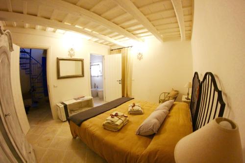 Ένα ή περισσότερα κρεβάτια σε δωμάτιο στο Il Borgo Trapanese