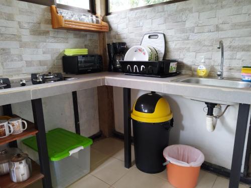 a kitchen with a sink and a counter top at Casa Bambu in Pavones