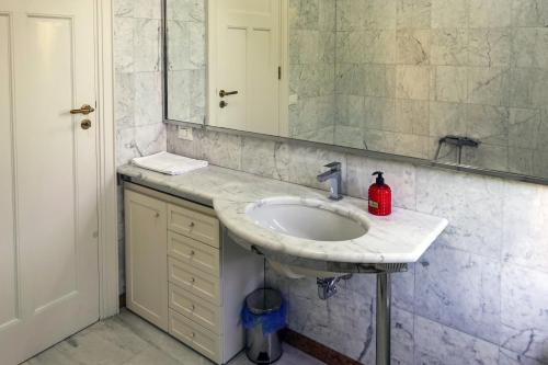 a bathroom with a sink and a mirror at Civico89 in Pescara