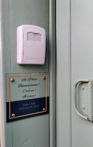 a hello kitty sign on a door with a pink box at LA PETITE BEAUVAISIENNE in Beauvais