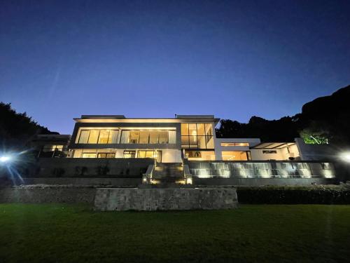 a large building at night with lights at Camelot Villa in Cape Town
