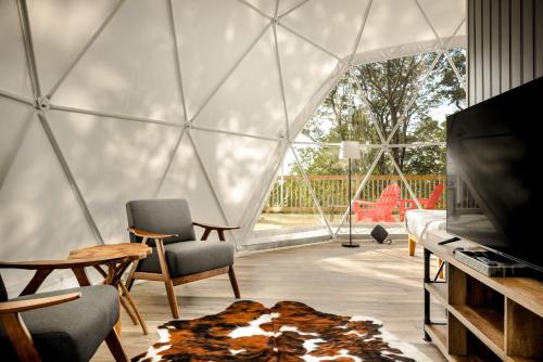 an interior view of a geodesic dome home with a living room at Luxe Dome w Hot Tub, Full Bath & Mountain View in Augusta