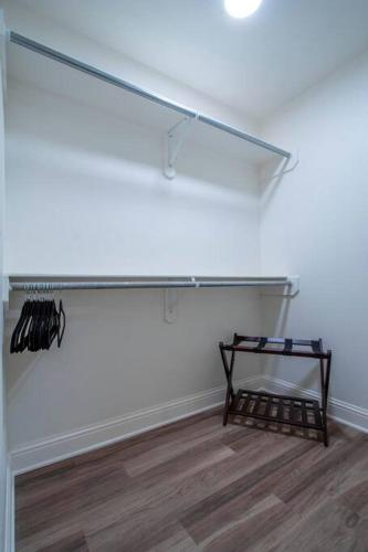 a glass shelf in a white room with a wooden floor at Retreat at Premier Parks in Longview