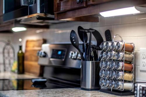 a kitchen counter with a container of kitchen utensils at Retreat at Premier Parks in Longview