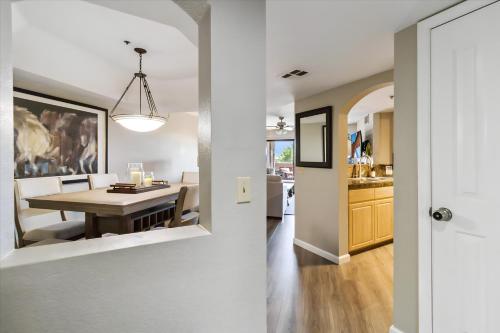 a kitchen and dining room with a table and a dining room at Biltmore Bliss Desert Retreat! in Phoenix