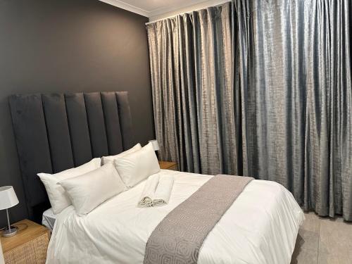 Ένα ή περισσότερα κρεβάτια σε δωμάτιο στο Canal View Estate & Resort