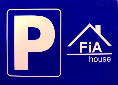 a sign with a large letter p and a fire house at FIA House in Skopje