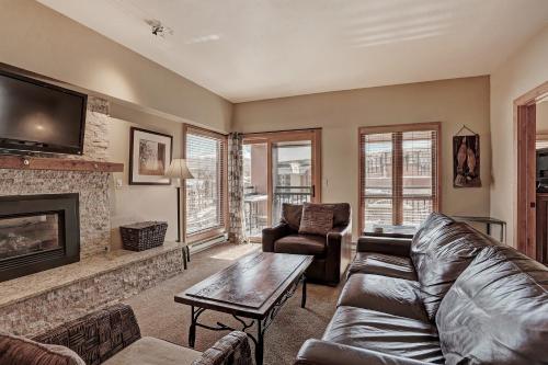 a living room with a couch and a fireplace at Ski In-Out Village at Breckenridge Condo in Breckenridge